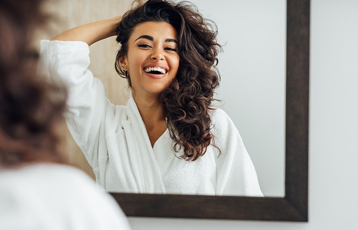 Woman admiring her beautiful hair