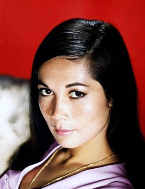 Nancy Kwan in a pink dress